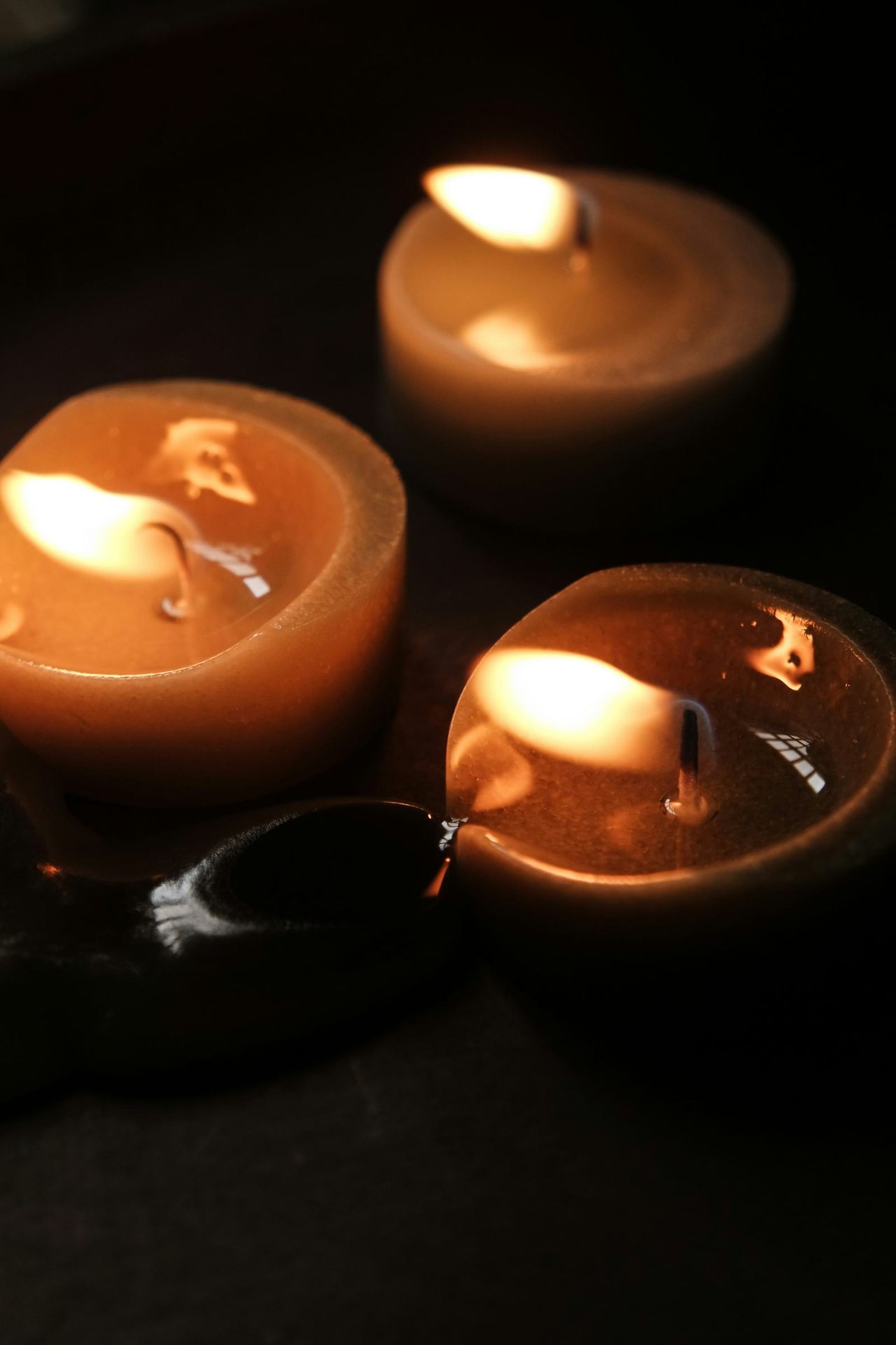 Three small candles burning low